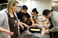 Guest speaker Julie Van Rosendaal, left, with students and faculty at the Communal Table Project